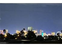 Night view of the dazzling city skyline, featuring iconic hotels and palm trees at 4809 S Torrey Pines Dr # 201, Las Vegas, NV 89103