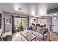 Bright living room featuring a sliding glass door to the outdoor balcony at 4809 S Torrey Pines Dr # 201, Las Vegas, NV 89103