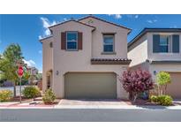 Two-story home featuring a two-car garage, neutral stucco, and low-maintenance landscaping at 7559 Chimney Point Ct, Las Vegas, NV 89166