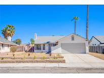Charming single-story home featuring a two-car garage and low-maintenance desert landscaping at 3118 Floral Vista Ave, Henderson, NV 89014