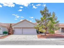 Charming single-story home with a two-car garage, well-maintained landscaping, and beautiful curb appeal at 3413 Freestone Ln, North Las Vegas, NV 89032