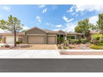 Inviting single-story home featuring a three-car garage and well-manicured front yard at 3483 French Daisy St, Las Vegas, NV 89135
