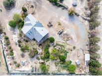 Expansive property showcasing a charming home, mature trees, and ample outdoor space at 5081 Riata Pl, Pahrump, NV 89060