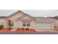 Charming single-story home with a two-car garage and well-maintained landscaping at 5236 Ladyhawk Way, Las Vegas, NV 89118