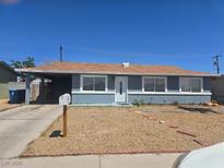 Charming single story home with a covered carport and low maintenance desert landscaping at 6212 Burgundy Way, Las Vegas, NV 89107