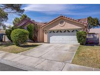Charming single-story home featuring a two-car garage and well-maintained landscaping at 6332 Sierra Pines Ct, Las Vegas, NV 89130