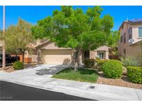Charming single-story home featuring a well-maintained front yard and a two-car garage at 11618 Costa Linda Ave, Las Vegas, NV 89138
