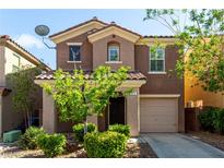 Well-maintained two-story house with desert landscaping, a tile roof and an attached one-car garage at 519 Brinkburn Point Ave, Las Vegas, NV 89178
