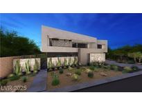 Modern two-story home boasts clean lines, desert landscaping, and a stone accent wall at 607 Grand Rim Dr, Henderson, NV 89012