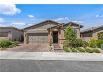 Charming single-story home with a well-manicured lawn and inviting curb appeal at 713 Webber Park St, Henderson, NV 89011