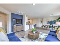 Bright living room boasts modern decor, stylish furnishings, and an open floor plan at 7920 Pandora Sky St # 281, North Las Vegas, NV 89084
