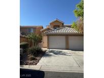 Traditional two-story home featuring a two-car garage and manicured landscaping at 8049 Celestial Ave # 201, Las Vegas, NV 89128