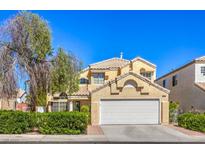 Charming two-story home features a well-manicured lawn, tile roof, and attached two-car garage at 8308 Tide Pool Dr, Las Vegas, NV 89128