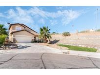 Charming single-Gathering home with a well-maintained yard and a two-car garage, offering curb appeal at 8345 Spruce Meadows Ave, Las Vegas, NV 89131