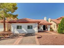 Charming single-story home featuring a red tile roof, desert landscaping, and a welcoming front entrance at 8924 Sail Bay Dr, Las Vegas, NV 89117