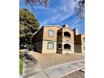 Charming two-story condo with private balconies and neat, low-maintenance landscaping at 221 Mission Newport Ln # 205, Las Vegas, NV 89107