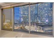 Modern living room showcasing stunning city views through expansive floor-to-ceiling windows at 3726 S Las Vegas Blvd # 1003, Las Vegas, NV 89158