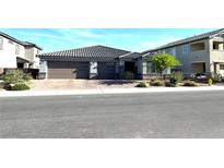 Beautiful single-story home featuring a three-car garage and desert landscaping in a tranquil suburban neighborhood at 3817 Grazing Gazelle Ave, North Las Vegas, NV 89084