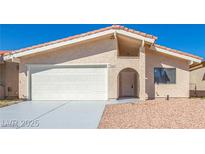 Inviting single-story home with a well-maintained front yard and two-car garage at 1900 Cameron St, Las Vegas, NV 89102