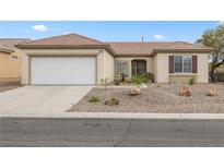 Charming single-story home features a well-maintained landscape, a two-car garage and a welcoming entrance at 2999 Gettysburg Ave, Henderson, NV 89052