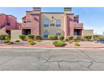 Charming condo building featuring desert landscaping and colorful stucco accents at 4050 Pacific Harbors Dr # 112, Las Vegas, NV 89121