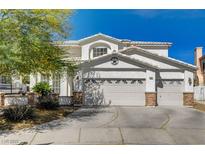 Charming two-story home featuring a three-car garage, and decorative stone accents at 6236 Desert Haven Rd, Las Vegas, NV 89130