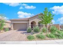 Charming single-story home with a two-car garage, desert landscaping, and a tile roof at 9590 Smiley Creek St, Las Vegas, NV 89178