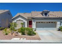 Charming single-story home featuring a well-maintained front yard and an attached two-car garage at 9724 Canyon Walk Ave, Las Vegas, NV 89147
