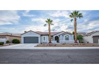 Charming single-story home with a well-maintained front yard and a two-car garage at 2099 Mountain City St, Henderson, NV 89052