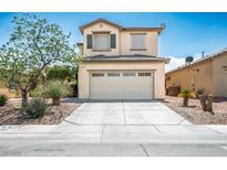 Charming two-story home features a well-manicured yard and attached two car garage at 53 Hoke Edward Ct, North Las Vegas, NV 89031
