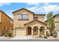 Charming two-story home with a well-maintained front yard and attached garage, perfect for Gathering living at 6743 Windingwood St, Las Vegas, NV 89148