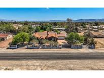 Charming single-story home with a lush landscaped front yard and wrought iron fence at 7760 Haven St, Las Vegas, NV 89123