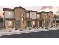 Charming townhome exteriors featuring stucco facades, tiled roofs, and desert landscaping at 858 Angwin Ln, Henderson, NV 89011