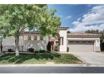 Charming single-story home with well-manicured lawn, mature trees, and a tile roof at 1116 Piazza Telle, Henderson, NV 89052