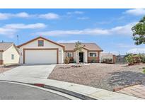 Charming single-story home featuring a well-maintained yard with desert landscaping at 2805 El Cubano Ct, North Las Vegas, NV 89030