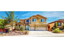 Charming two-story home with attached two car garage and landscaped front yard at 524 Blanche Ct, Henderson, NV 89052