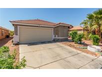 Charming single-story home featuring a tile roof, two-car garage, and well-maintained landscaping at 6489 Coldwater Bay Dr, Las Vegas, NV 89122
