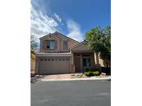 Charming two-story home featuring a well-manicured front yard and a spacious two-car garage at 7589 Grassy Bank St, Las Vegas, NV 89139