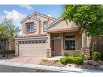 Charming two-story home with a well-maintained front yard and a two car garage at 7589 Grassy Bank St, Las Vegas, NV 89139