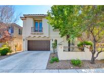 Charming two-story home with a well-manicured front yard and a two-car garage at 11833 Amistoso Ln, Las Vegas, NV 89138