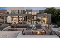 Modern home featuring a swimming pool, spa, and an outdoor kitchen with great mountain views at 1491 Reims Dr, Henderson, NV 89012