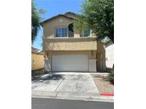 Two-story home with stucco siding and a two-car garage at 4356 Pittsfield St, Las Vegas, NV 89115