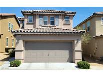 Charming two-story home with a gray garage door, landscaped front yard and visible house number at 8626 Anderson Dale Ave, Las Vegas, NV 89178