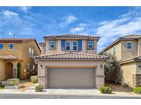 Charming two-story home with a two-car garage, desert landscaping, and a tile roof at 8626 Anderson Dale Ave, Las Vegas, NV 89178
