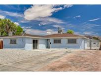Charming single-story home featuring a spacious driveway and beautiful desert landscaping at 108 Prince Ln, Las Vegas, NV 89110