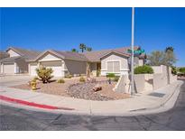 Charming single-story home with a desert-landscaped front yard, tile roof, and attached two-car garage at 1766 Baja Ln, Henderson, NV 89012
