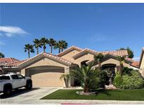 Charming single-story home featuring a well-maintained lawn and an attached two-car garage at 2986 Matese Dr, Henderson, NV 89052