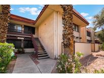Inviting condo complex with well-maintained landscaping and cozy, covered walkways and stairs at 3120 S Eastern Ave # 5, Las Vegas, NV 89169