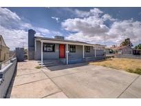 Charming single-story home with gray exterior, front porch, and a spacious concrete driveway at 5463 Waltham Ln, Las Vegas, NV 89122