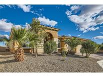 Inviting single-story home boasting mature palm trees, meticulous landscaping, and a warm, neutral color palette at 5790 Douglas Everett St, Las Vegas, NV 89120